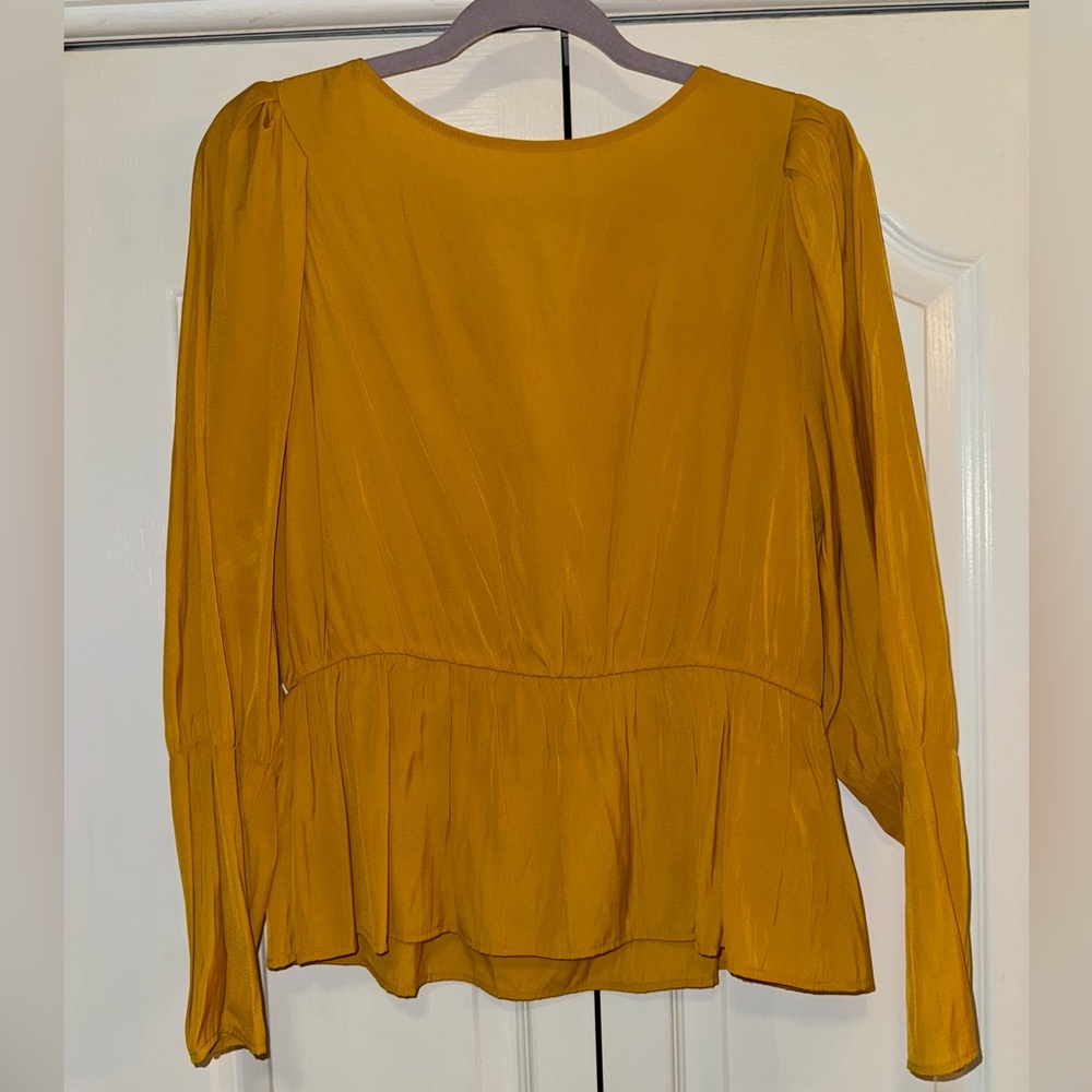 Gold long-sleeve peplum blouse